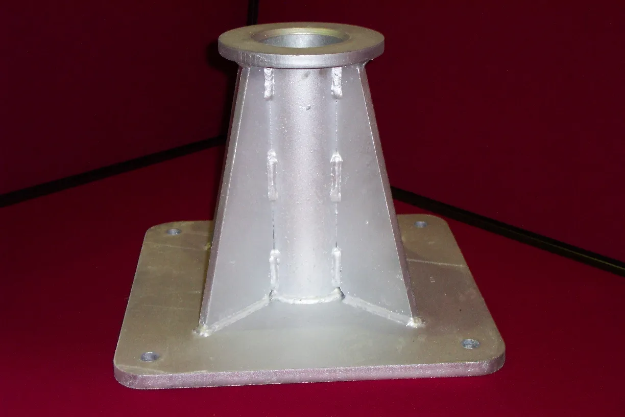 Somers cast-in lifting socket with bolted base plate — aluminium finish, welded gusset reinforcement.