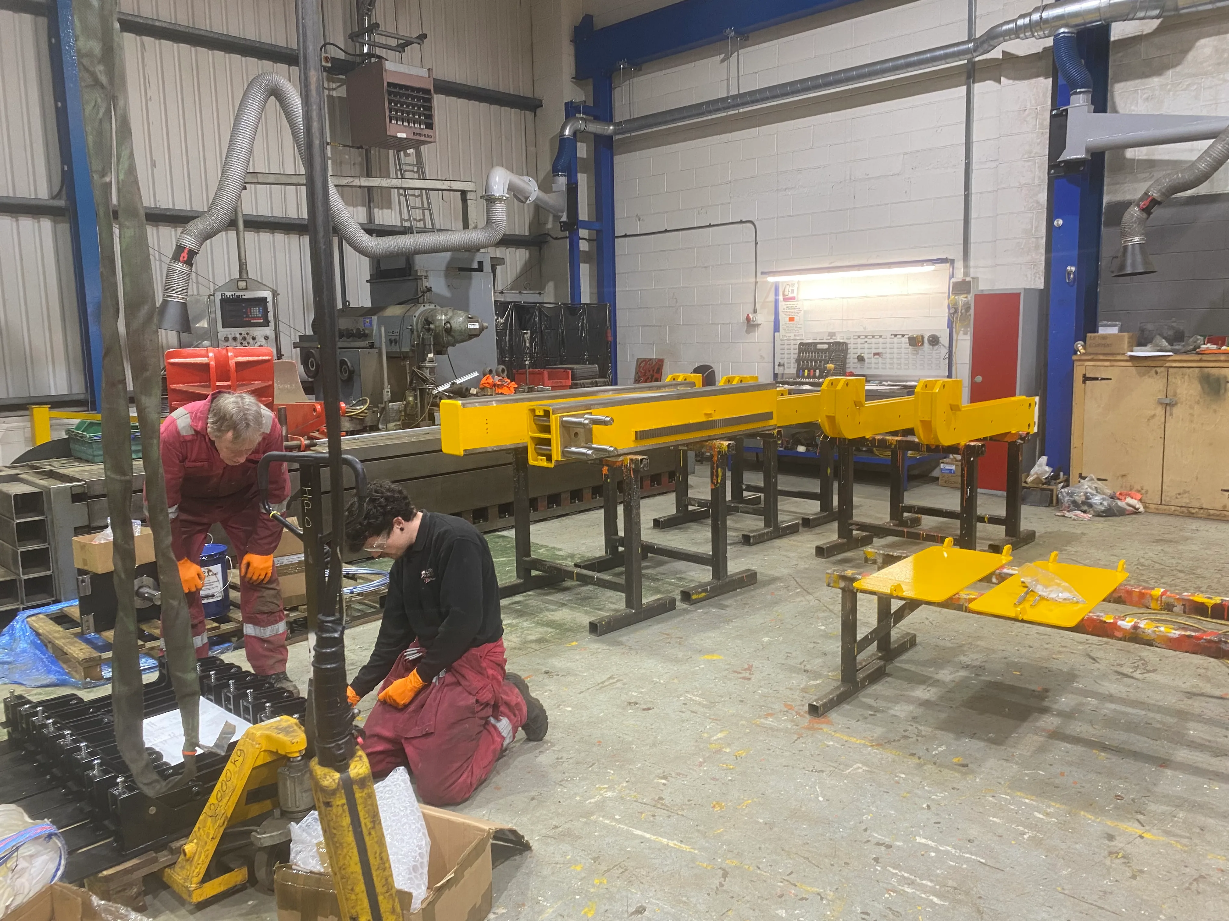 Somers service engineers inspecting a refurbished crane beam — part of ongoing LOLER compliance activity.
