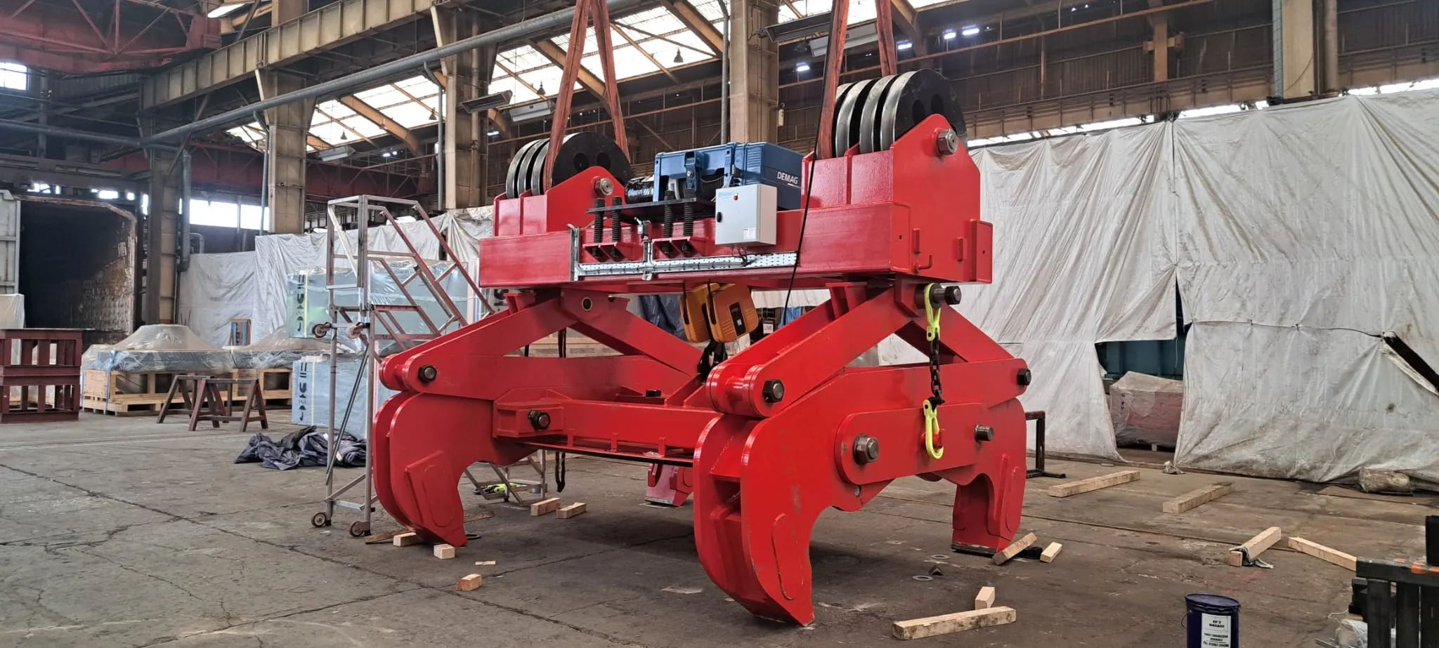 Red Somers duplex slab tong with twin Demag hoist mechanisms, photographed at the Somers works ahead of dispatch to ArcelorMittal.